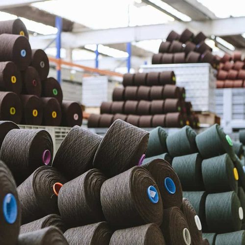 Reels of wool in storage room in woollen mill